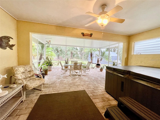 sunroom / solarium with ceiling fan