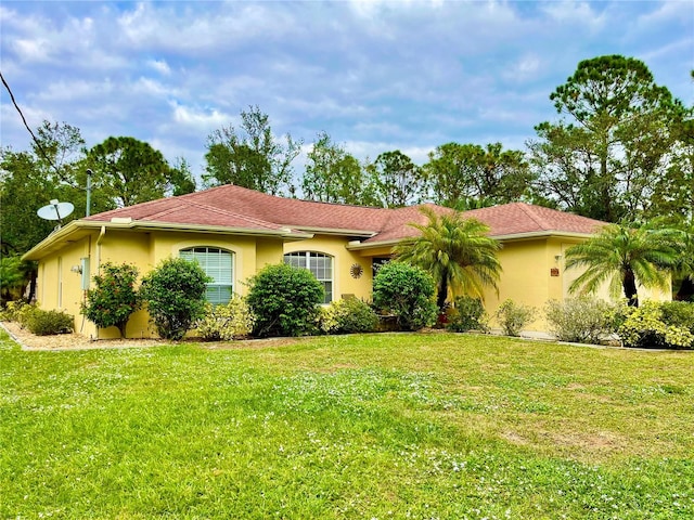 view of front of property with a front lawn