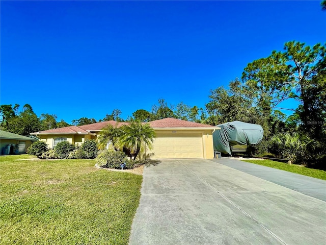 ranch-style house with a front lawn and a garage