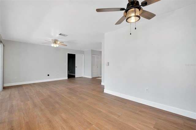 spare room with ceiling fan and light hardwood / wood-style flooring