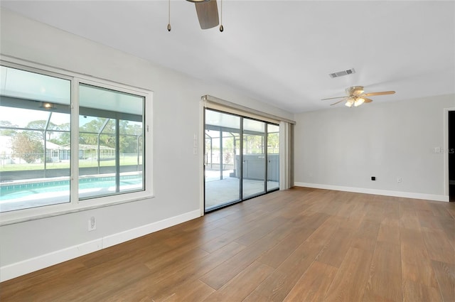 unfurnished room featuring ceiling fan and light hardwood / wood-style floors