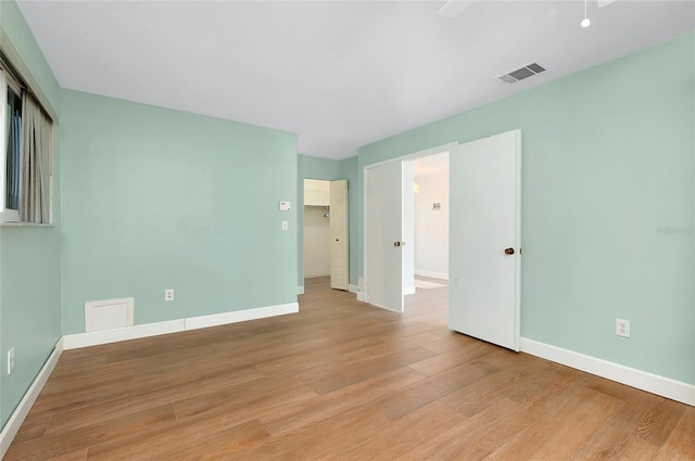 spare room with light hardwood / wood-style floors