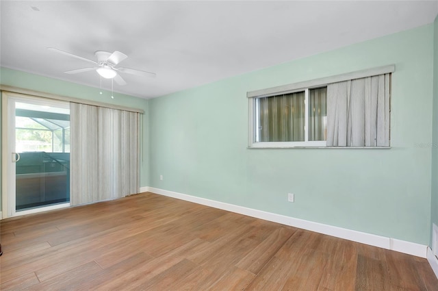 spare room featuring ceiling fan and light wood-type flooring