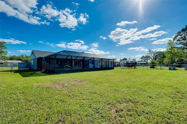 view of yard with glass enclosure