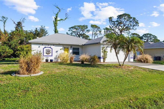 ranch-style home with a garage and a front yard