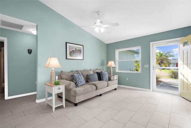 tiled living room with ceiling fan and lofted ceiling