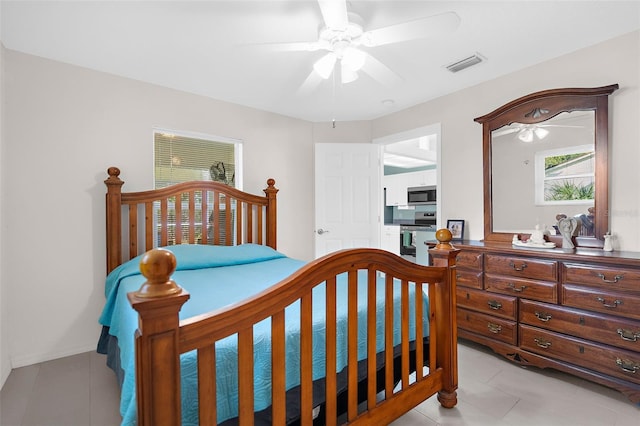 bedroom featuring ceiling fan and light tile patterned floors