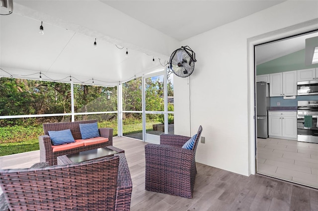 sunroom with vaulted ceiling