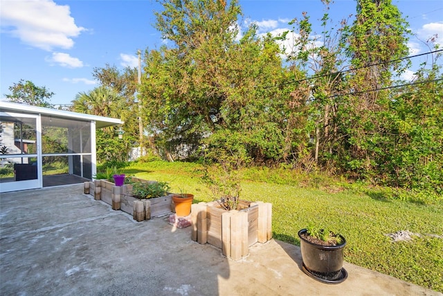 view of patio featuring a sunroom