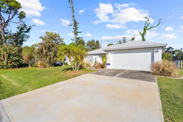 view of front facade featuring a garage and a front lawn