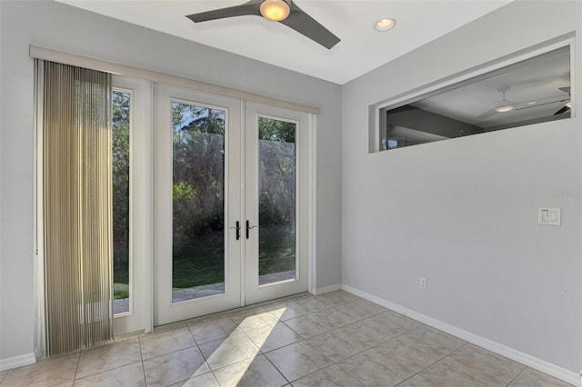 entryway featuring ceiling fan, french doors, and light tile patterned floors