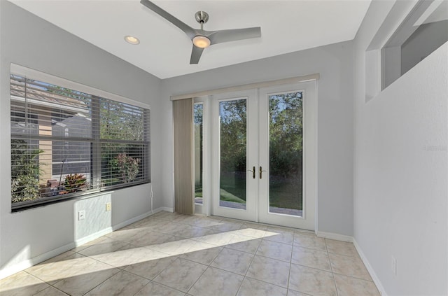 entryway featuring french doors, ceiling fan, and light tile patterned flooring