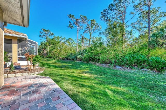 view of yard with a sunroom