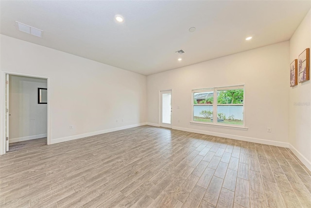 unfurnished room featuring light hardwood / wood-style floors