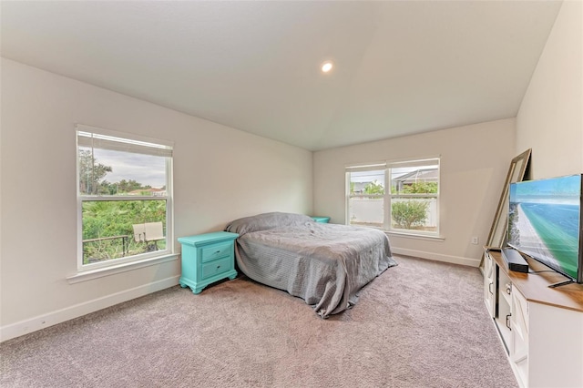 bedroom featuring light carpet