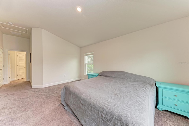 carpeted bedroom featuring lofted ceiling