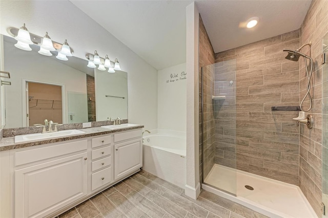 bathroom featuring vanity and plus walk in shower