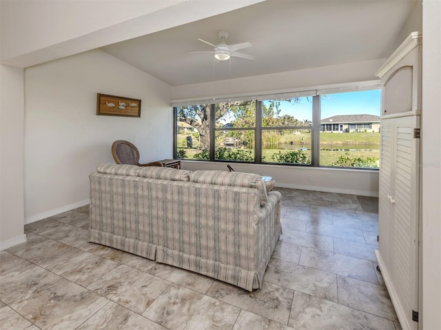 living room featuring vaulted ceiling and ceiling fan