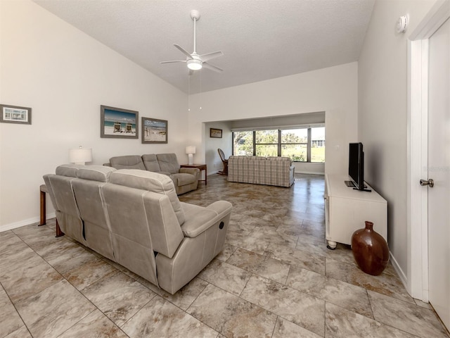 living room featuring ceiling fan, high vaulted ceiling, and a textured ceiling