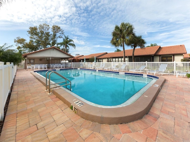 view of swimming pool featuring a patio