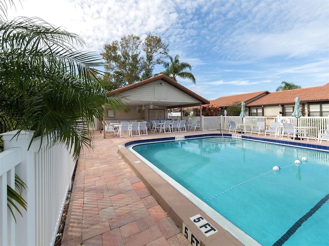 view of swimming pool featuring a patio area