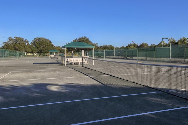 view of tennis court featuring a gazebo