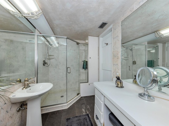 bathroom with a shower with door