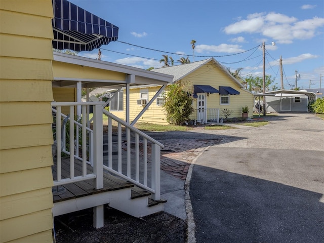 view of side of property featuring a carport