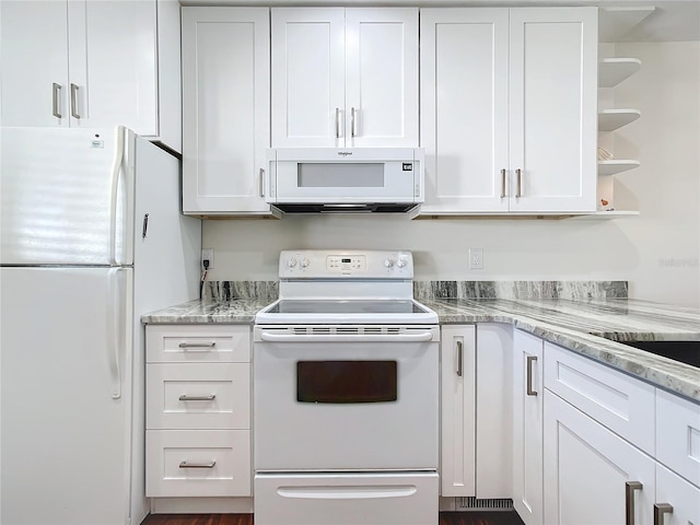 kitchen featuring white cabinets and white appliances