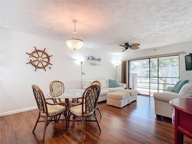 dining area with dark hardwood / wood-style floors and ceiling fan