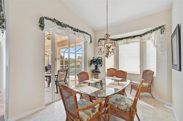 tiled dining space with a notable chandelier and lofted ceiling