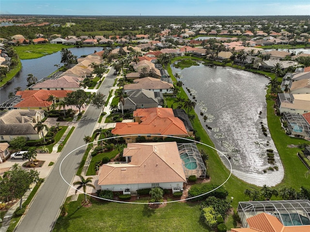 bird's eye view with a water view