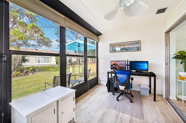 office space with ceiling fan, light hardwood / wood-style flooring, and lofted ceiling