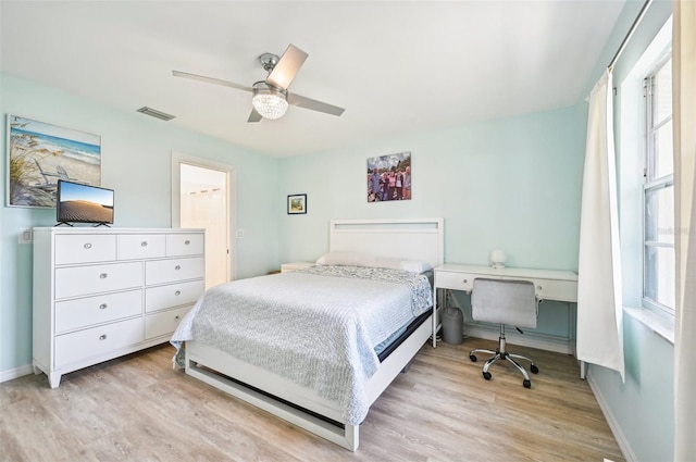 bedroom with ceiling fan and light hardwood / wood-style flooring