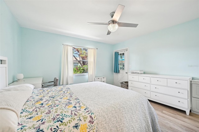 bedroom featuring light wood-type flooring and ceiling fan