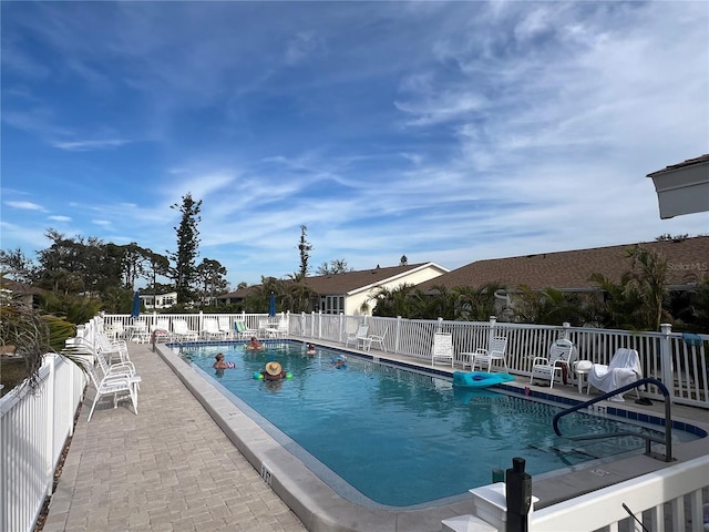 view of swimming pool with a patio area