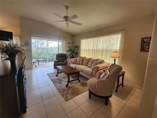 living room featuring vaulted ceiling, light tile patterned floors, and ceiling fan