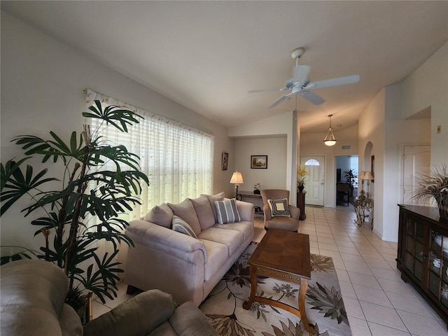 living room featuring vaulted ceiling, ceiling fan, and light tile patterned flooring