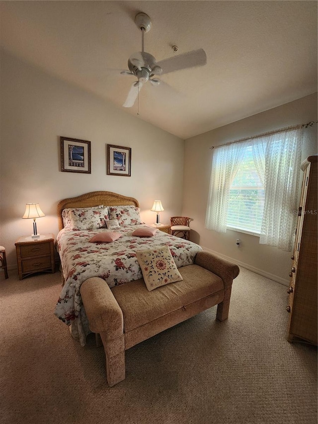 bedroom featuring ceiling fan, lofted ceiling, and carpet floors