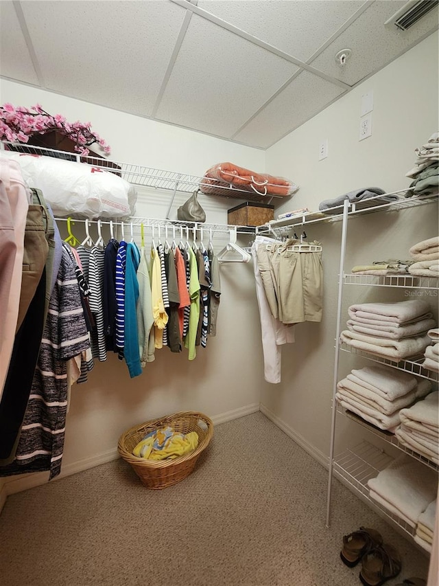 spacious closet featuring a paneled ceiling