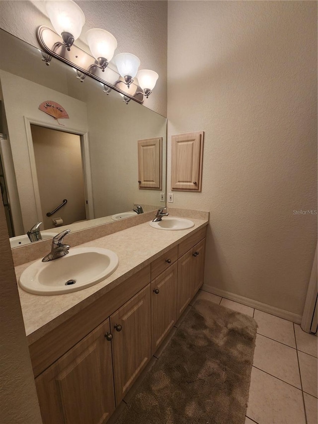 bathroom with tile patterned flooring and vanity