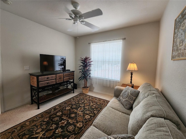 living room with carpet floors and ceiling fan