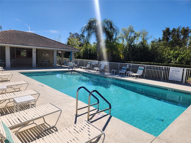 view of swimming pool featuring a patio area