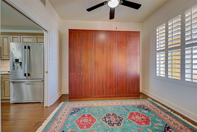 entrance foyer with ceiling fan and wood-type flooring