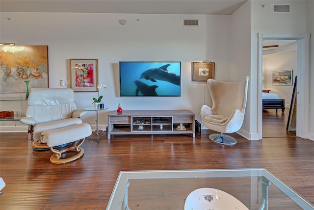 living room with dark hardwood / wood-style floors