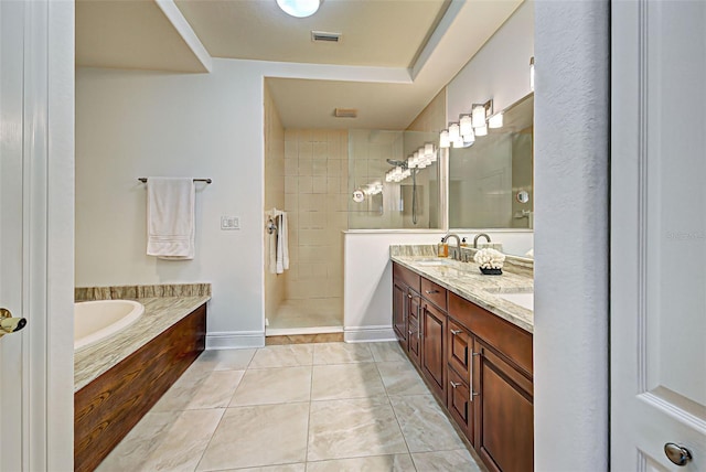 bathroom with tile patterned floors, vanity, and plus walk in shower