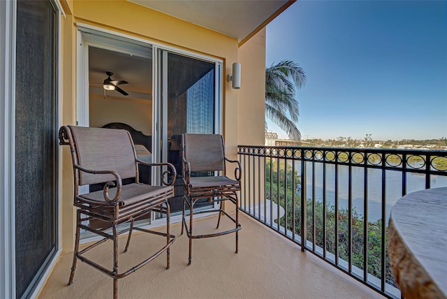 balcony featuring a water view