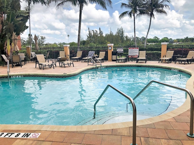 view of swimming pool with a patio area