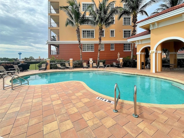 view of swimming pool with a patio area