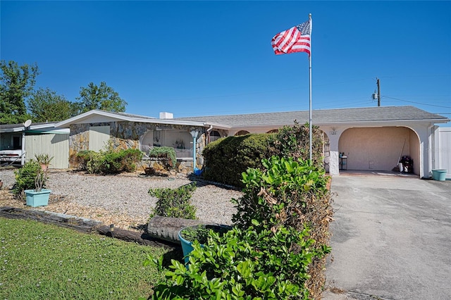 view of front of home featuring a carport